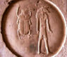 Ancient Egyptian hieroglyph sundisc with scarab and Khnum